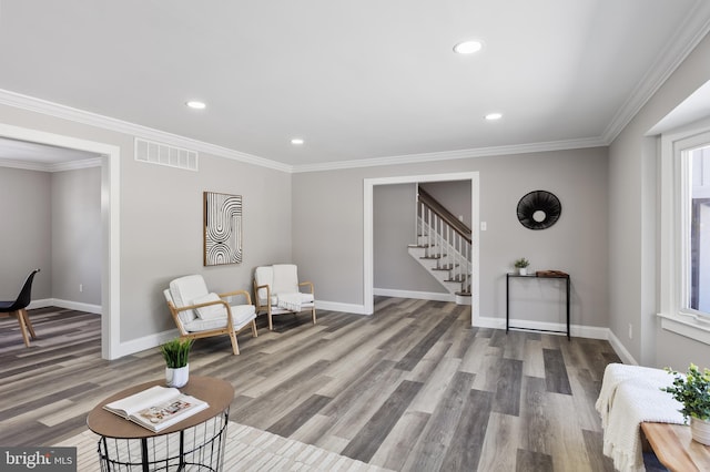 sitting room featuring crown molding and wood-type flooring