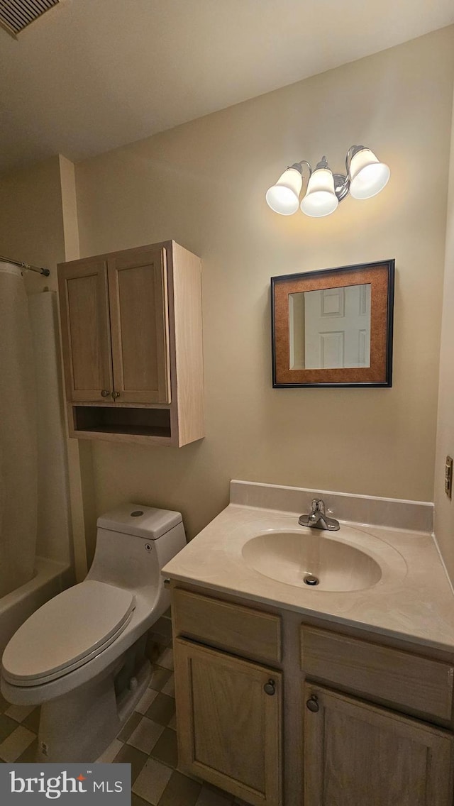 full bathroom featuring shower / bath combo, vanity, and toilet