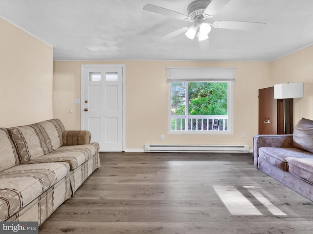 living room with ceiling fan, a baseboard heating unit, and hardwood / wood-style flooring