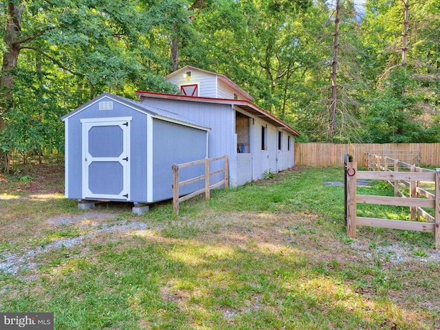 view of outbuilding with a lawn