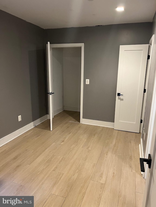 unfurnished bedroom featuring light hardwood / wood-style floors