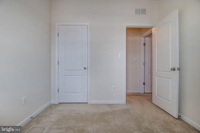 unfurnished bedroom with light carpet