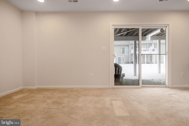 empty room featuring light colored carpet