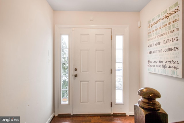 foyer with dark hardwood / wood-style floors