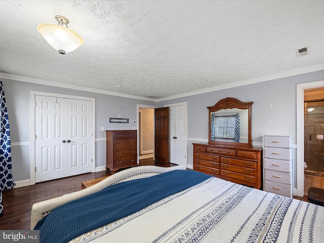 bedroom with a textured ceiling, crown molding, and dark wood-type flooring