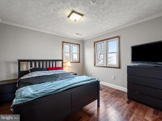 bedroom featuring dark hardwood / wood-style floors, ornamental molding, and a textured ceiling