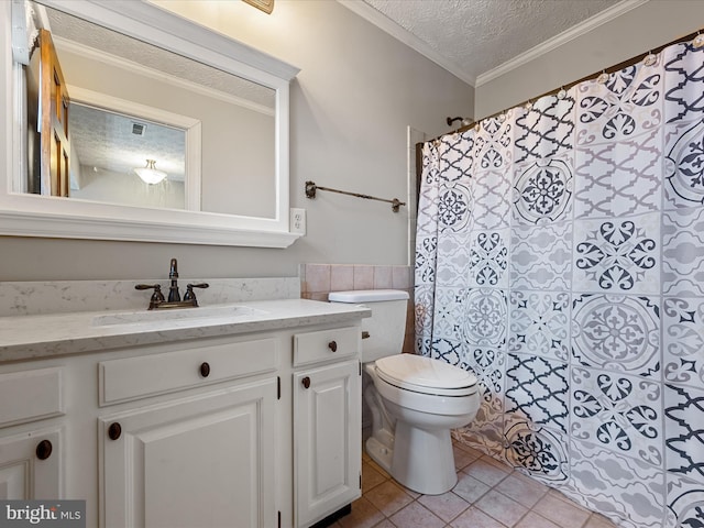 bathroom with tile patterned floors, a textured ceiling, toilet, vanity, and ornamental molding