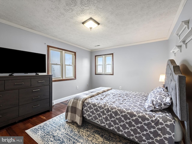 bedroom with crown molding, dark wood-type flooring, and a textured ceiling