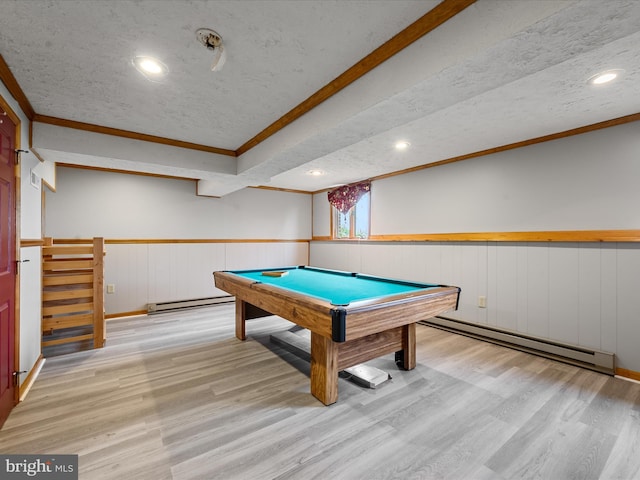 game room featuring a textured ceiling, a baseboard radiator, light hardwood / wood-style flooring, and pool table