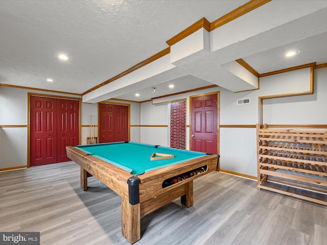 playroom with hardwood / wood-style floors, ornamental molding, a textured ceiling, and billiards