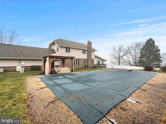 view of pool featuring a gazebo, a patio, and a lawn