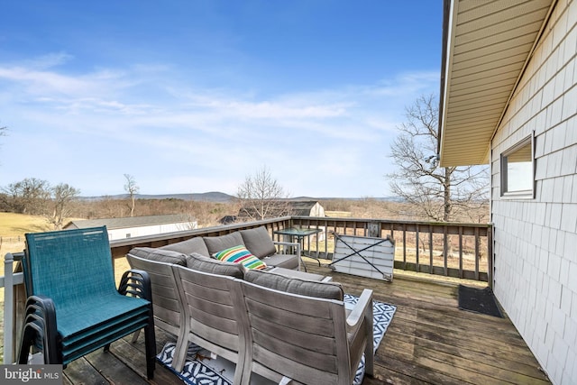 wooden deck featuring outdoor lounge area