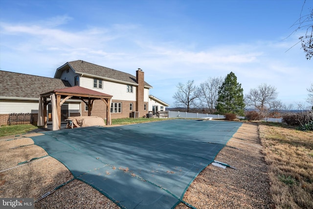 exterior space featuring a gazebo and a patio area