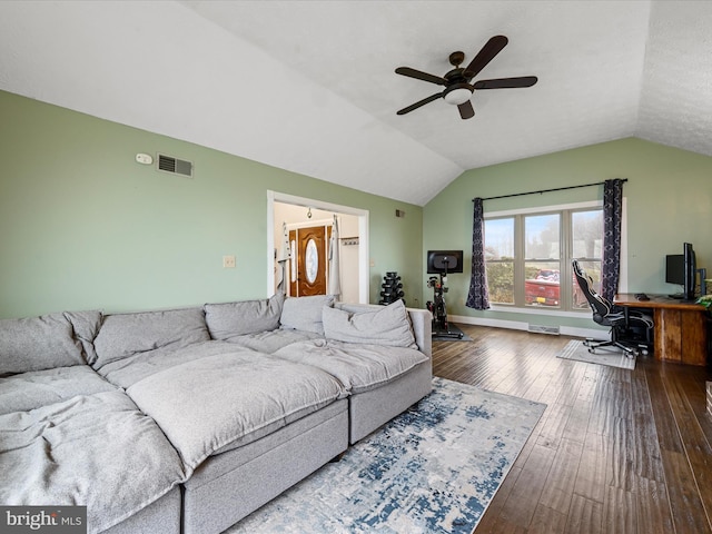 living room with hardwood / wood-style floors, ceiling fan, and vaulted ceiling