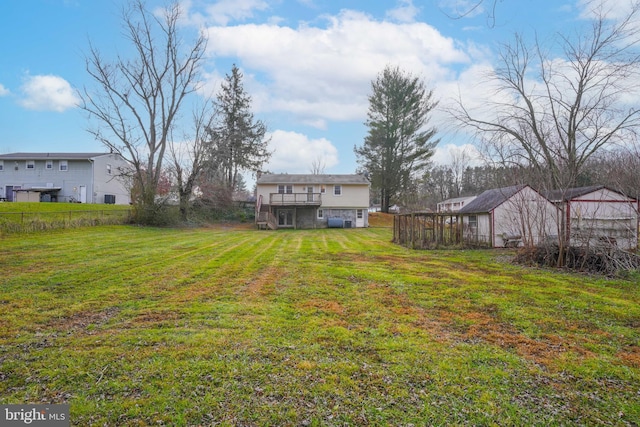 view of yard with a wooden deck