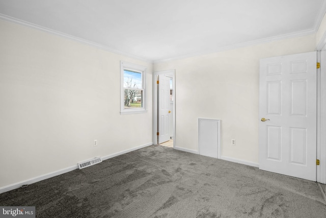 carpeted empty room featuring ornamental molding