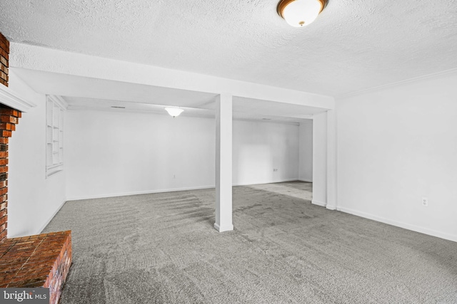 basement with carpet and a textured ceiling