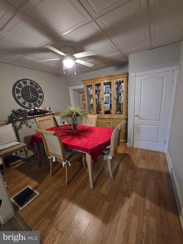 dining area featuring wood-type flooring and ceiling fan