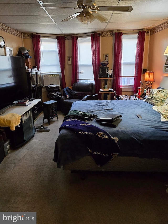 bedroom featuring carpet floors, ceiling fan, and cooling unit