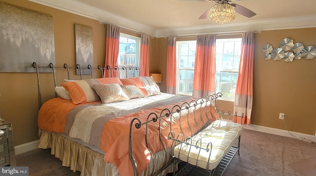 bedroom featuring ceiling fan, crown molding, and dark carpet