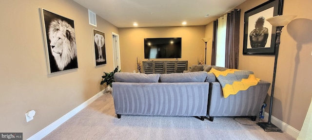 living room featuring light carpet