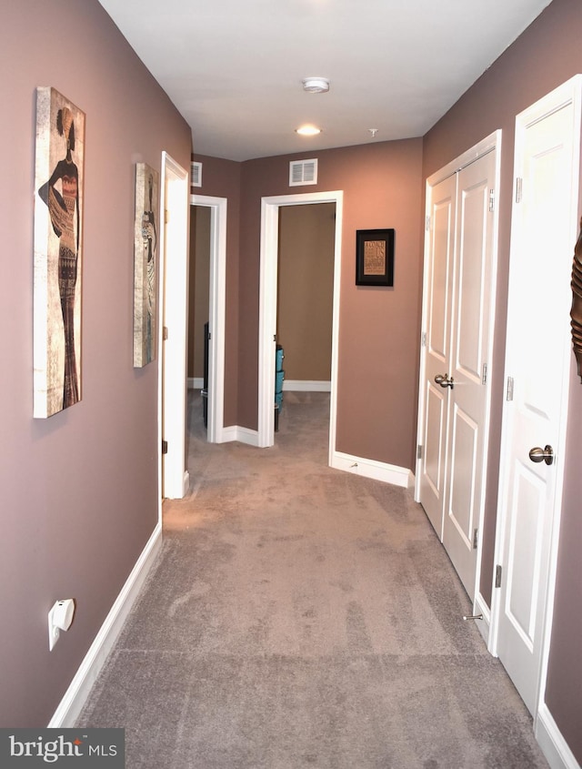 hallway featuring carpet flooring