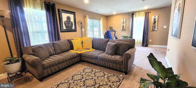 living room featuring light carpet