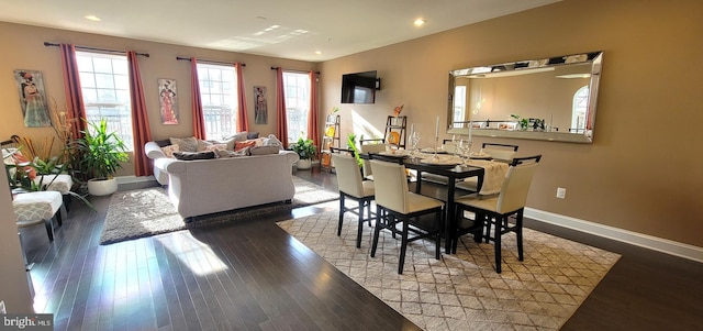 dining space with hardwood / wood-style flooring