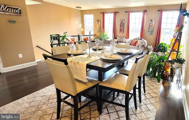 dining area with hardwood / wood-style floors