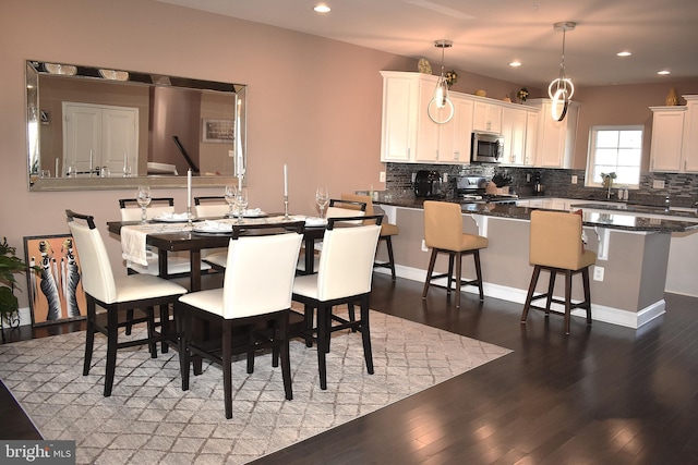 dining room featuring dark wood-type flooring