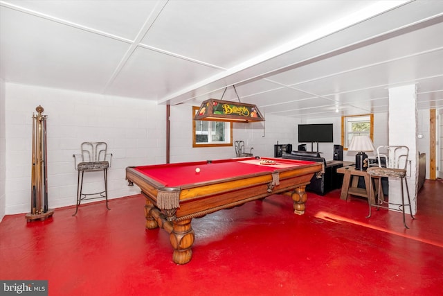 playroom with concrete floors and billiards