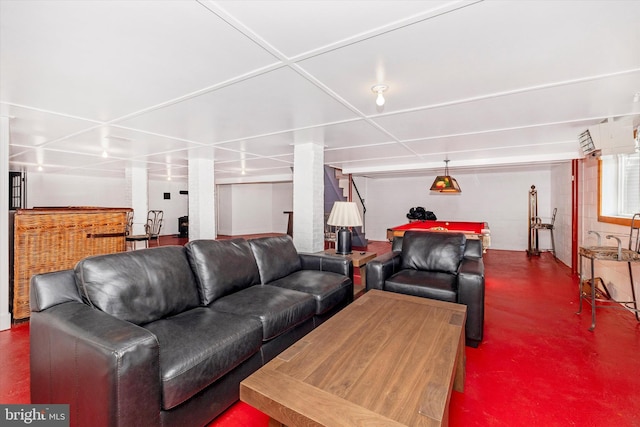 living room featuring concrete flooring