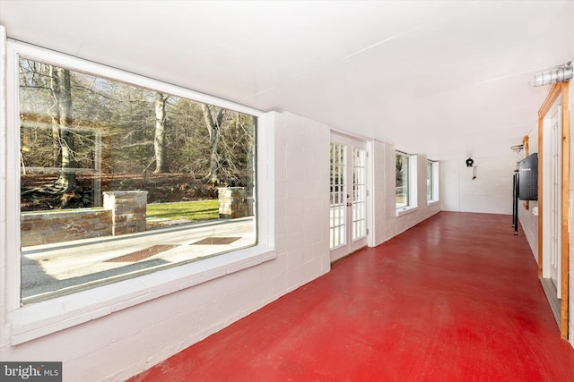 unfurnished sunroom with french doors