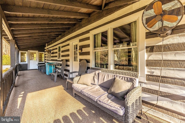 exterior space with lofted ceiling with beams and wooden ceiling