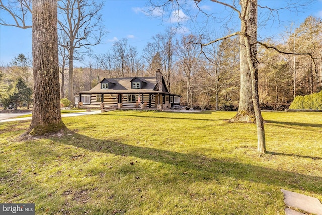 view of front of home with a porch and a front lawn