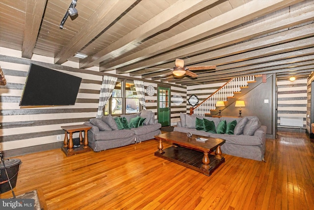 living room featuring beam ceiling, ceiling fan, wooden ceiling, and hardwood / wood-style flooring