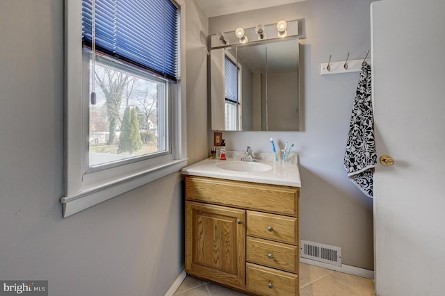 bathroom featuring tile patterned flooring and vanity