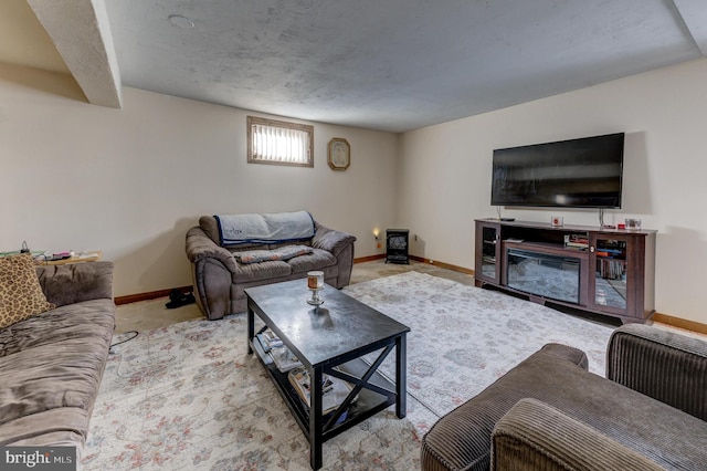 living room featuring light colored carpet and a fireplace