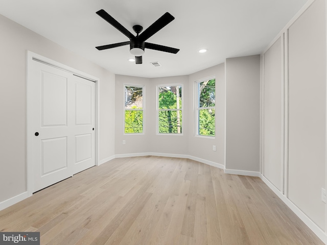 unfurnished bedroom featuring light hardwood / wood-style flooring and ceiling fan