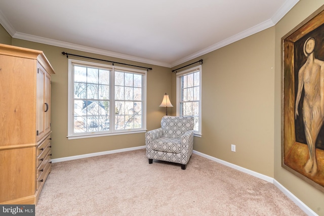 sitting room with crown molding and light colored carpet