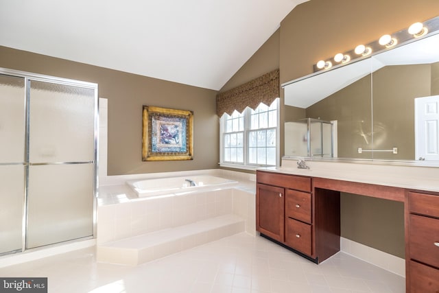 bathroom with vanity, tile patterned floors, lofted ceiling, and separate shower and tub