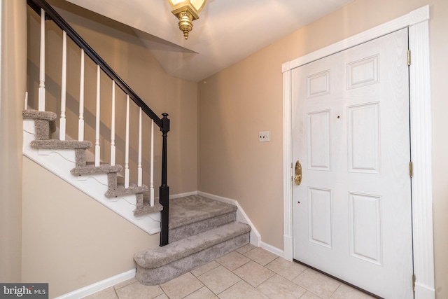 entryway with light tile patterned floors