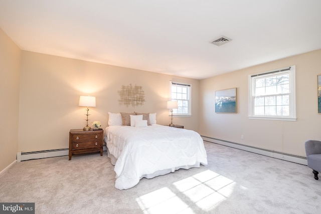 carpeted bedroom with a baseboard radiator