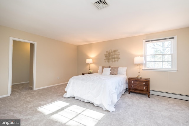 carpeted bedroom featuring a baseboard radiator