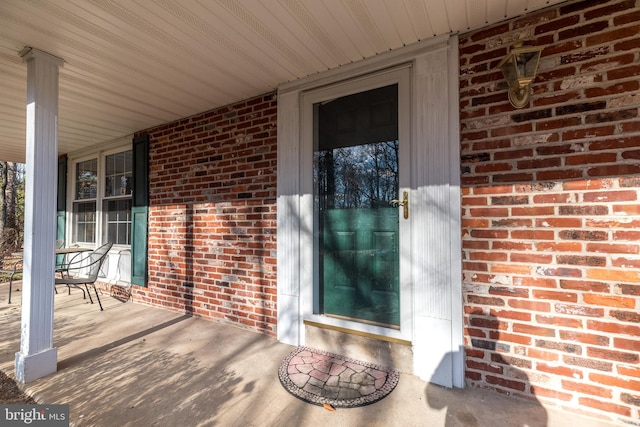 doorway to property featuring a porch