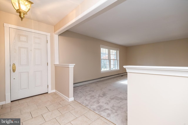 entrance foyer with beamed ceiling, light carpet, and a baseboard radiator