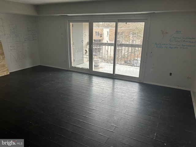 empty room featuring dark wood-type flooring