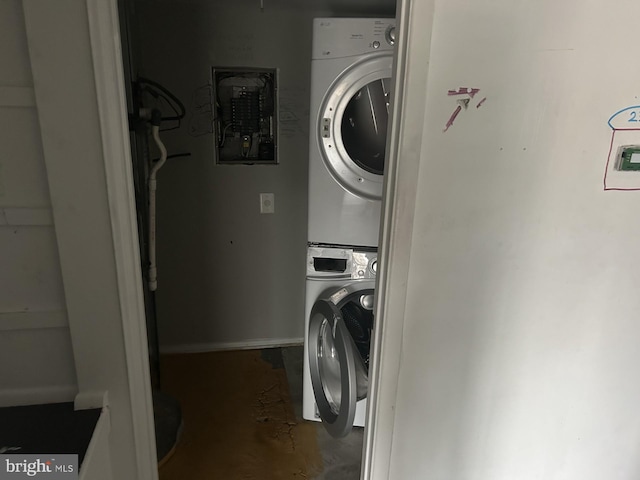 laundry room featuring stacked washer and dryer