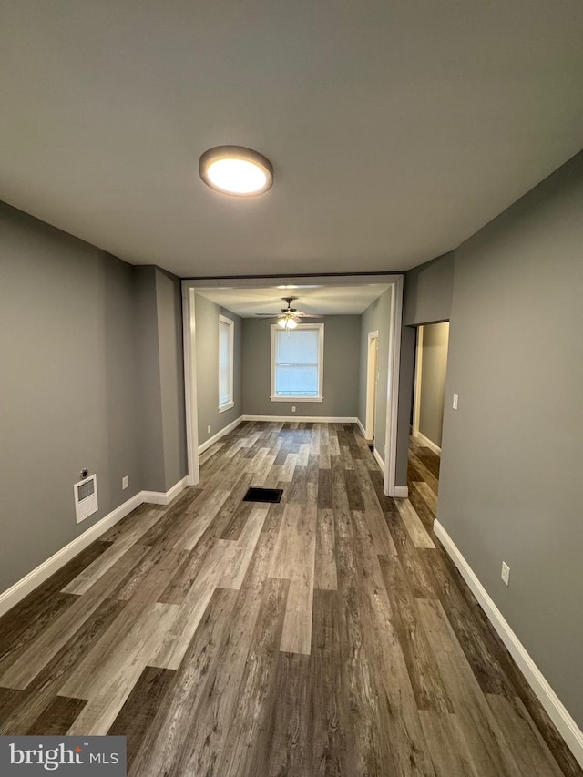 hall with hardwood / wood-style floors