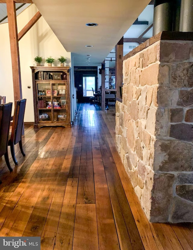 hallway with wood-type flooring